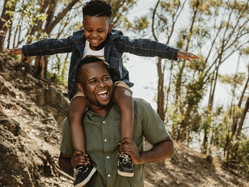 Father and son having a great time on vacation stock photo