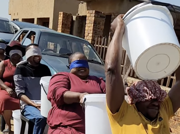 WATCH: Hilarious family moment passing water buckets backwards