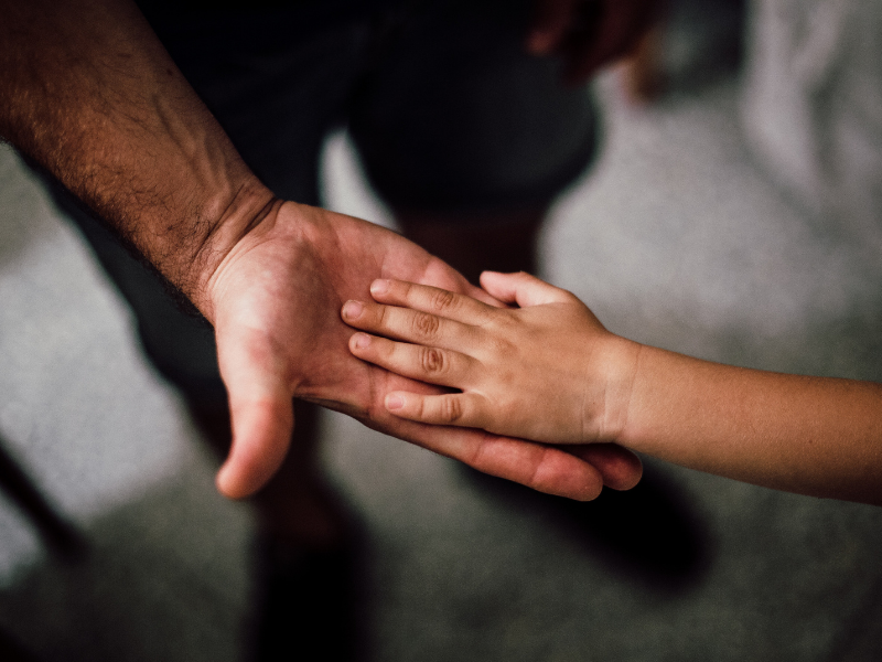 Selective focus photography of child's hand