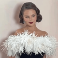 Selena Gomez wearing a strapless gown with a feather trim