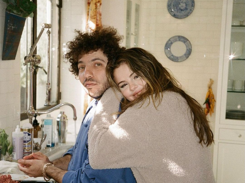 Selena Gomez and Benny Blanco standing in a kitchen