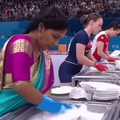 Several women compete in a dishwashing competition