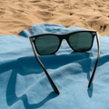 Shades on a beach towel