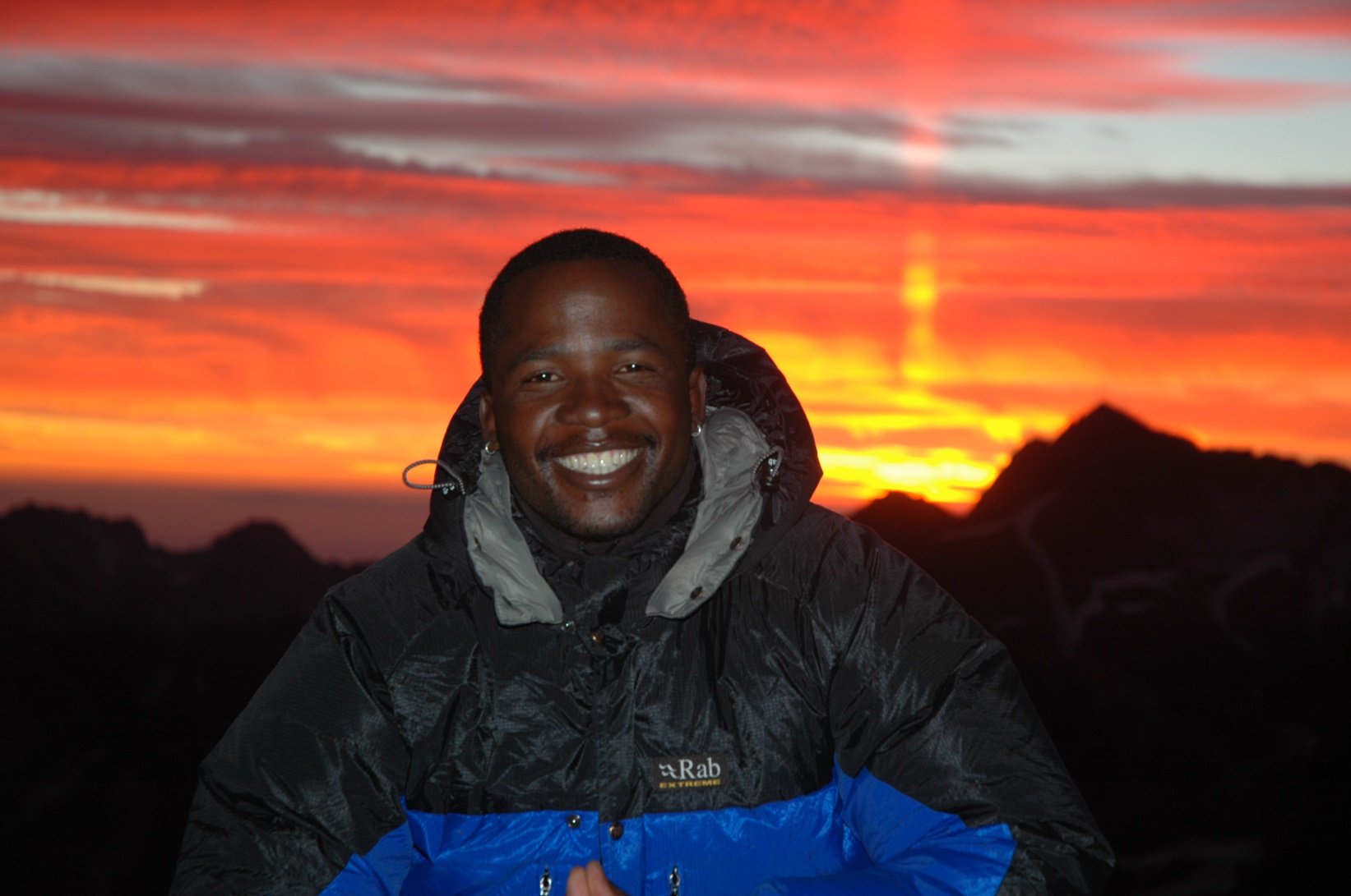 Sibusiso Vilane mountaineering at sunset