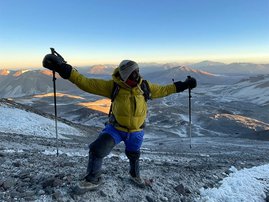 Sibusiso Vilane summitting a mountain