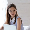 Woman side stares at colleague