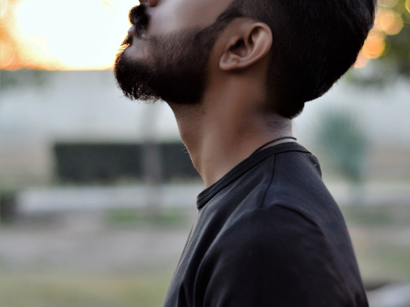 Side profile of man with beard and closed eyes