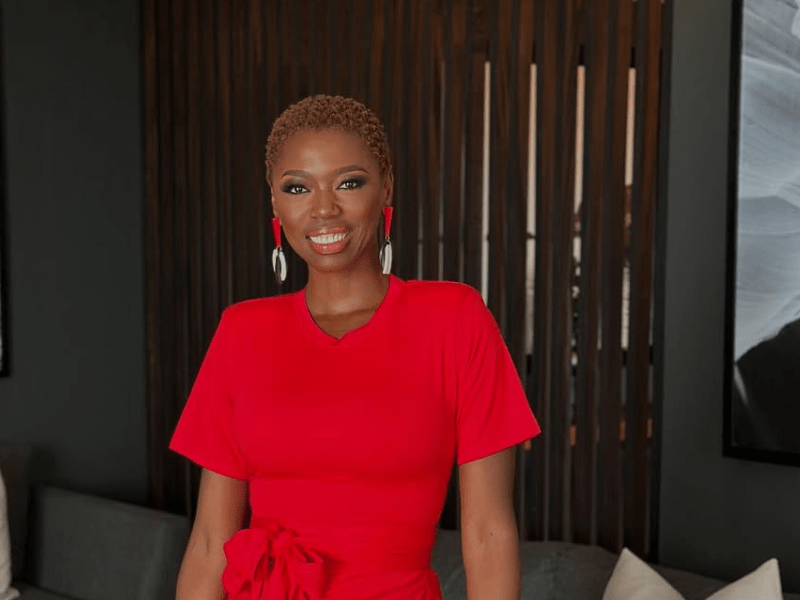 Singer Lira wearing a red dress