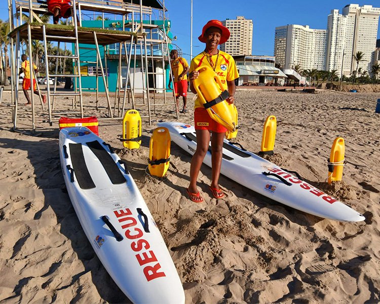 Sisanda at the beach with rescue equipment