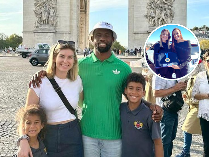 Rachel and Siya Kolisi posing in front of the Arc de Triomphe with their children