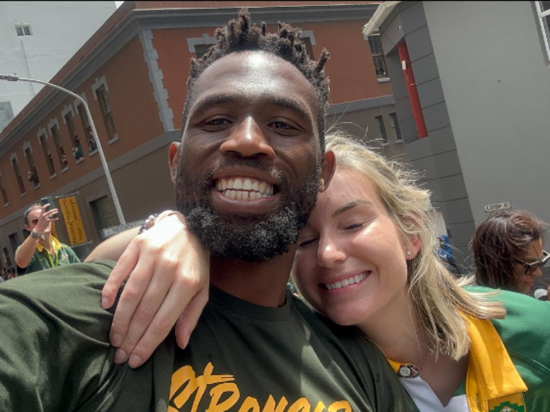 Siya and Rachel Kolisi holding each other smiling