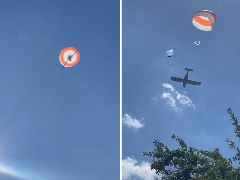 Small aircraft parachutes towards the ground