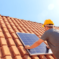 Solar panel installation on a house roof