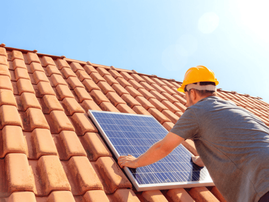 Solar panel installation on a house roof