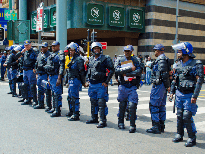 South African police officers stand guard in Johannesburg