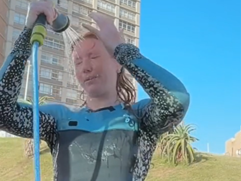 South African swimmer Christy Gilmour using a portable shower