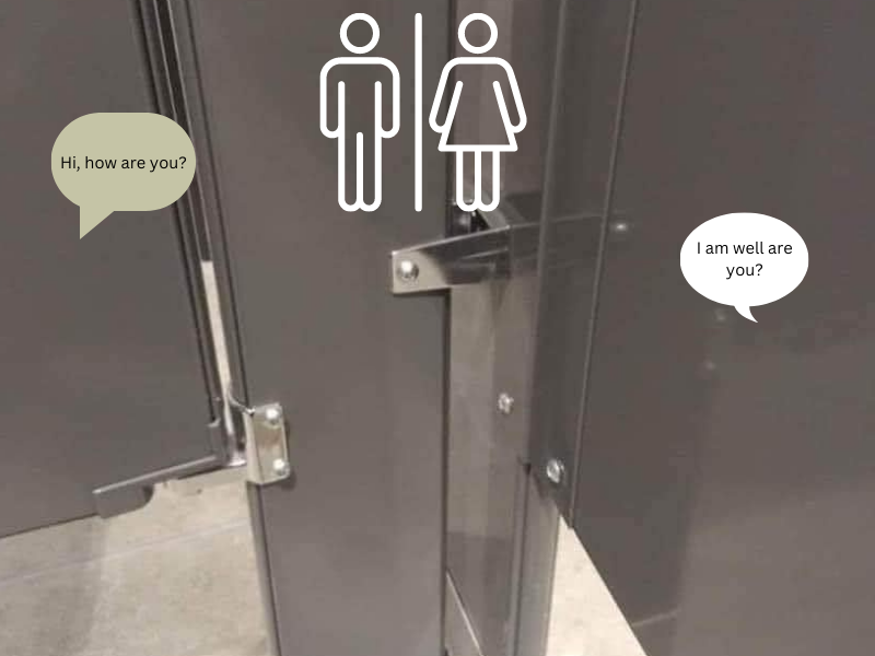 Speech bubbles outside toilet stalls at public restroom