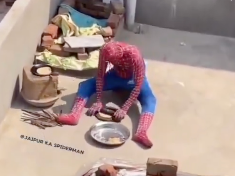 Spiderman spotted frying roti on rooftop