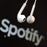 Spotify shares soar as company swings to profit
