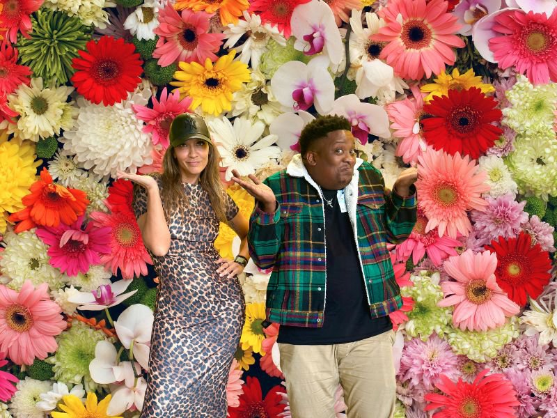 Stacey and J Sbu with flower background