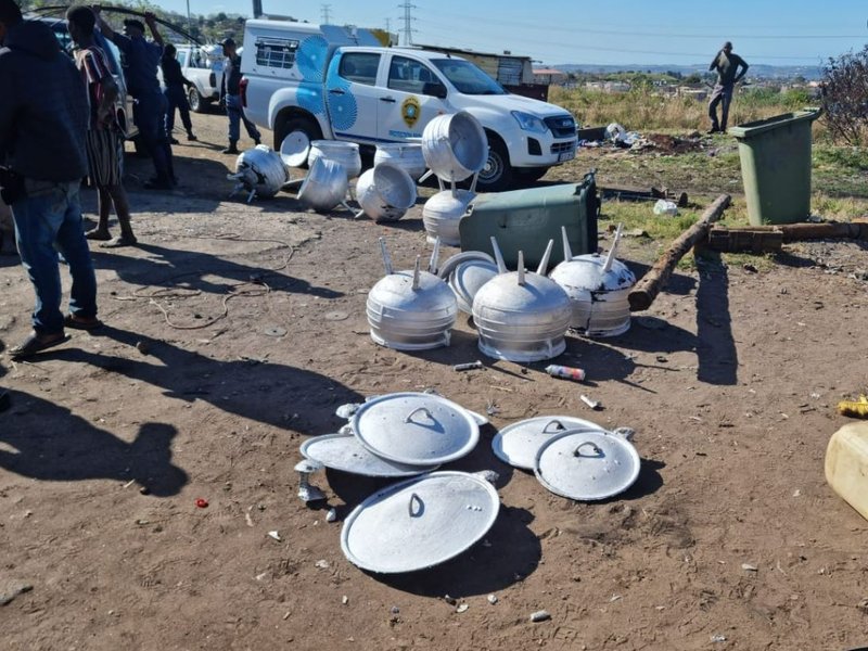 Illegal scrap metal dealer making three-legged pots using copper, cables allegedly belonging to eThekwini Municipality.