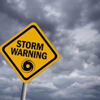 Storm warning sign over stormy sky