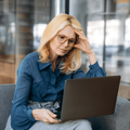Stressed looking mature woman in an office setting