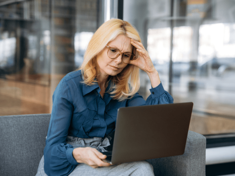 Stressed looking mature woman in an office setting