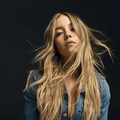 Sydney Sweeney wearing a denim jacket