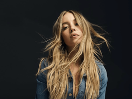 Sydney Sweeney wearing a denim jacket