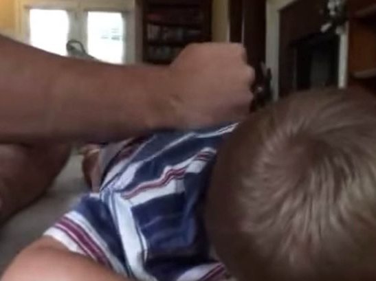TEASER-Dad-keeps-up-the-beats-on-his-giggling-little-boy.jpg