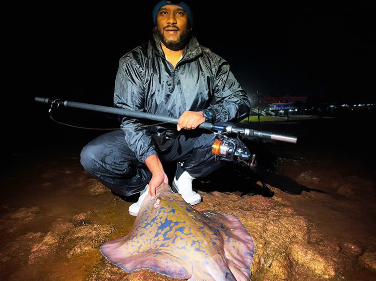 Taahir Khader with a blue ray caught on the mid-South Coast