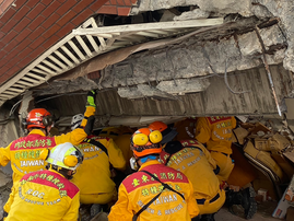 Helicopter plucks miners to safety as Taiwan searches for missing after quake