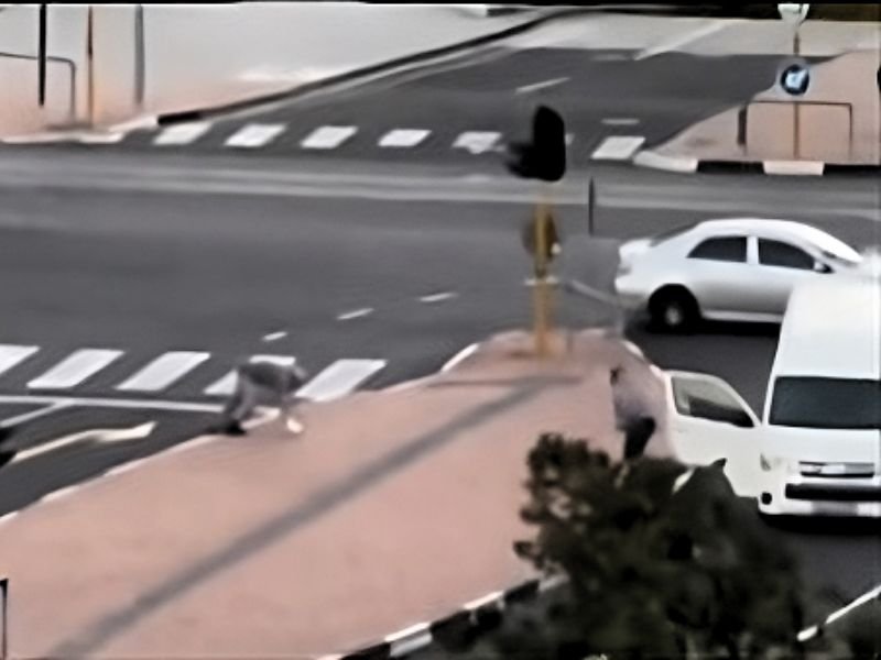 taxi driver helps old man across road