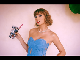 Taylor Swift wearing a blue dress