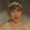 Taylor Swift wearing a floral headband with beads