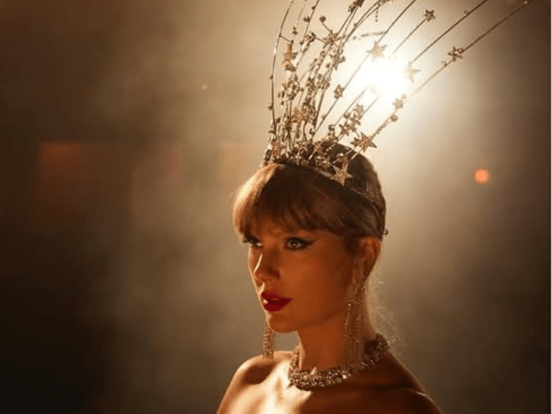 Taylor Swift wearing a dramatic star themed crown