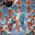 Taylor Swift and dancers wear matching blue costumes and glittering swim cap