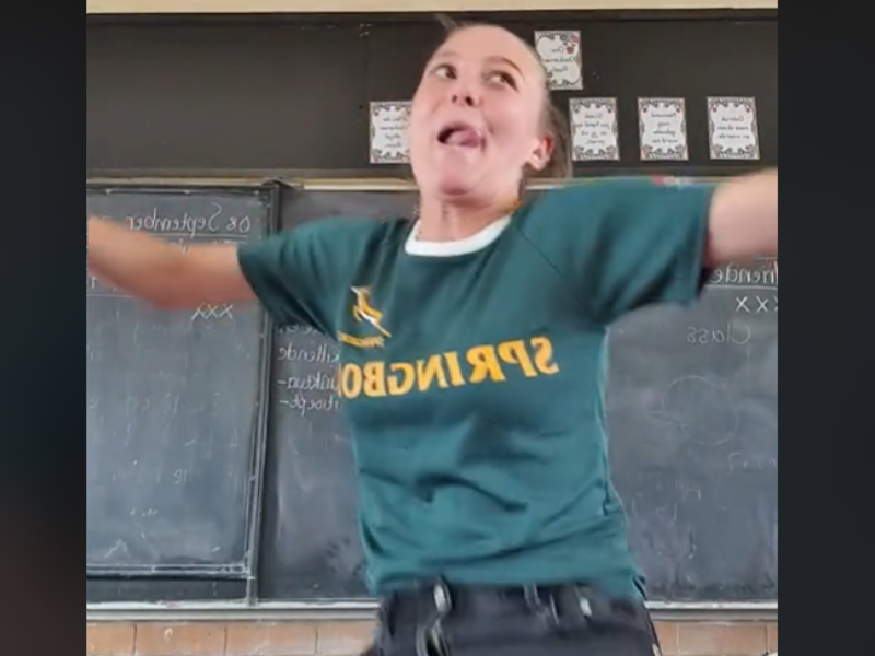 Teacher wearing a Springbok shirt dancing in classroom