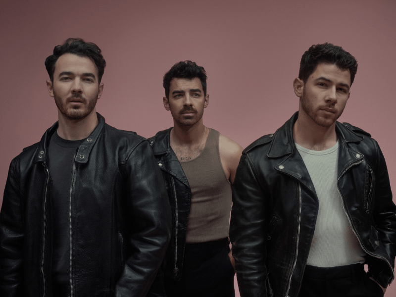 The Jonas Brothers wearing cool and edgy coordinated outfits
