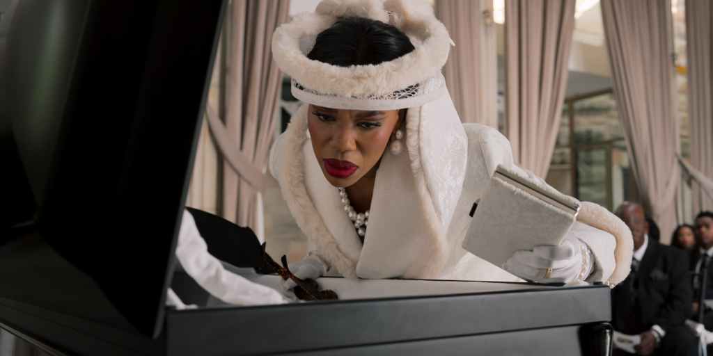 Gugu Gumede as Joyce Gomora in The Polygamist | Cr. Courtesy of Netflix © 2026