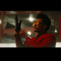 The Weeknd wearing a red suit in Blinding Lights