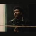 The Weeknd singing while playing the piano