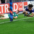 France's wing Théo Attissogbe dives across the line