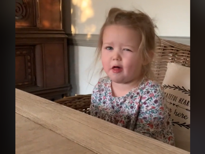 Toddler plays fake sick with mum