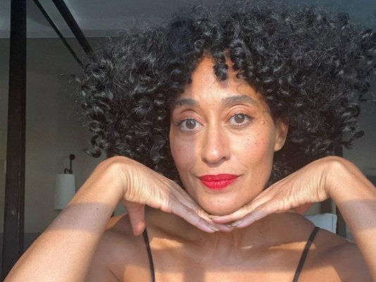 Tracee Ellis Ross wearing a red lipstick