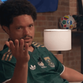Trevor Noah wearing a green Bafana Bafana jersey