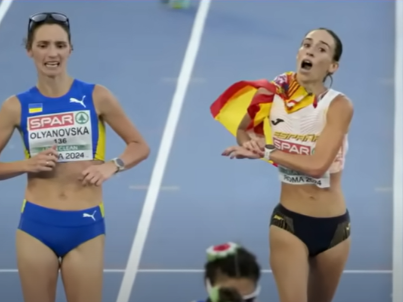 Two athletes competing to place during a speed walking race
