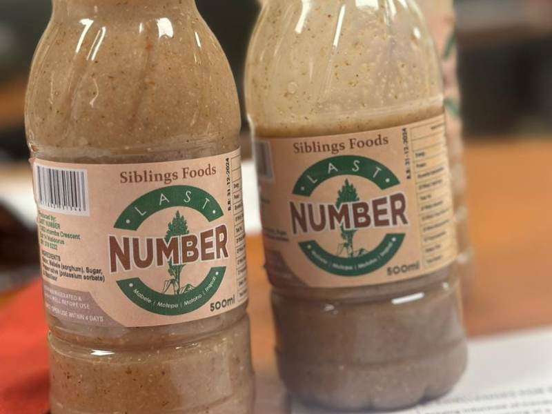 Two bottles of drinking pap on a table top