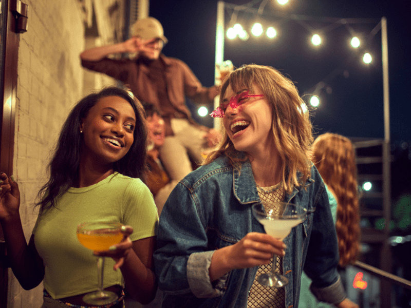Female friends drinking cocktails
